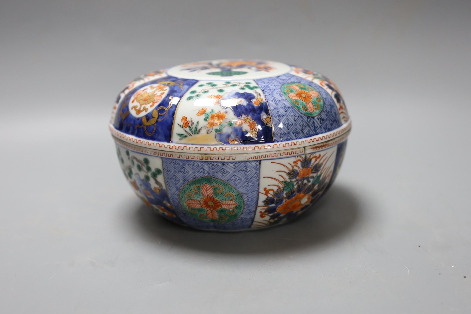 A Japanese Imari box and cover, by Fukugawa, a.f. 19cm diameter